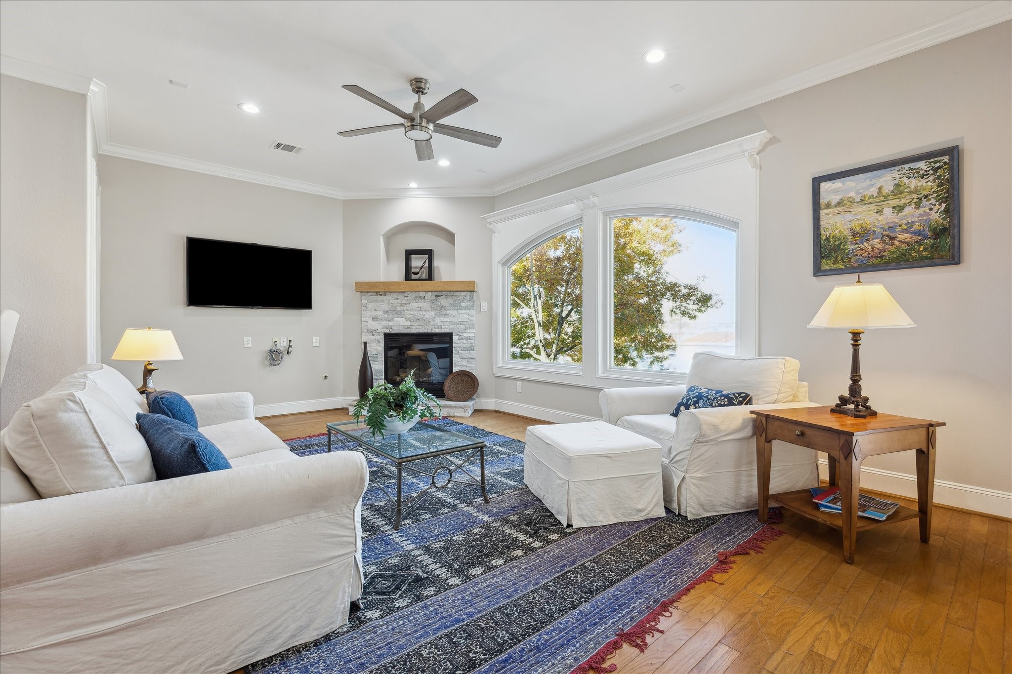 4701 Inker Street Houston, TX 77007 - Photo 11 of 45 a living room with furniture a fireplace and a flat screen tv