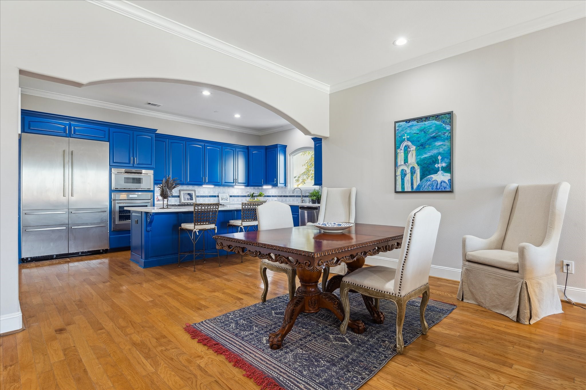 4701 Inker Street Houston, TX 77007 - Photo 15 of 45 a workspace with stainless steel appliances wooden floor dining table and chair