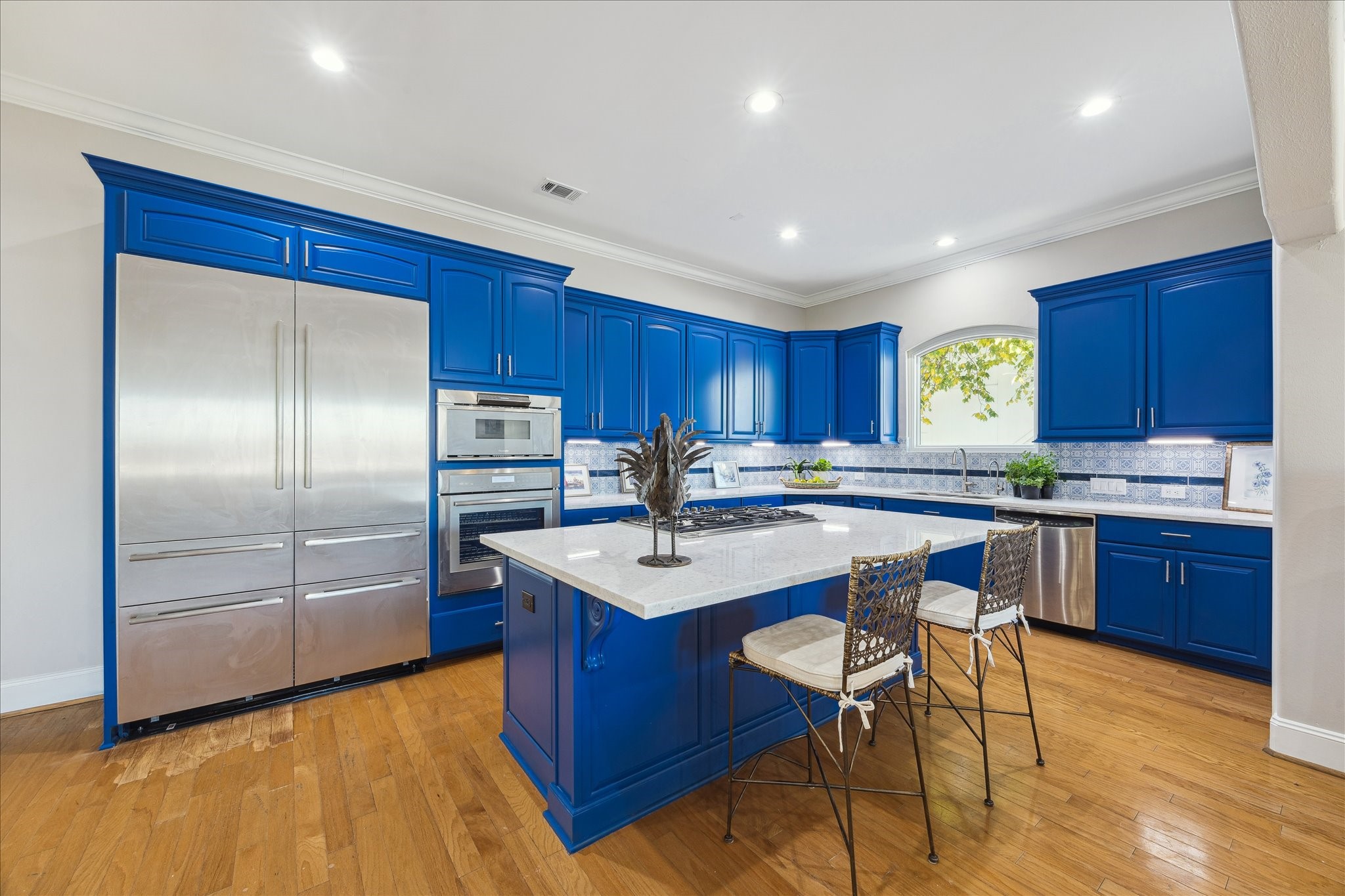 4701 Inker Street Houston, TX 77007 - Photo 17 of 45 a kitchen with stainless steel appliances granite countertop a sink a stove a refrigerator and wooden cabinets