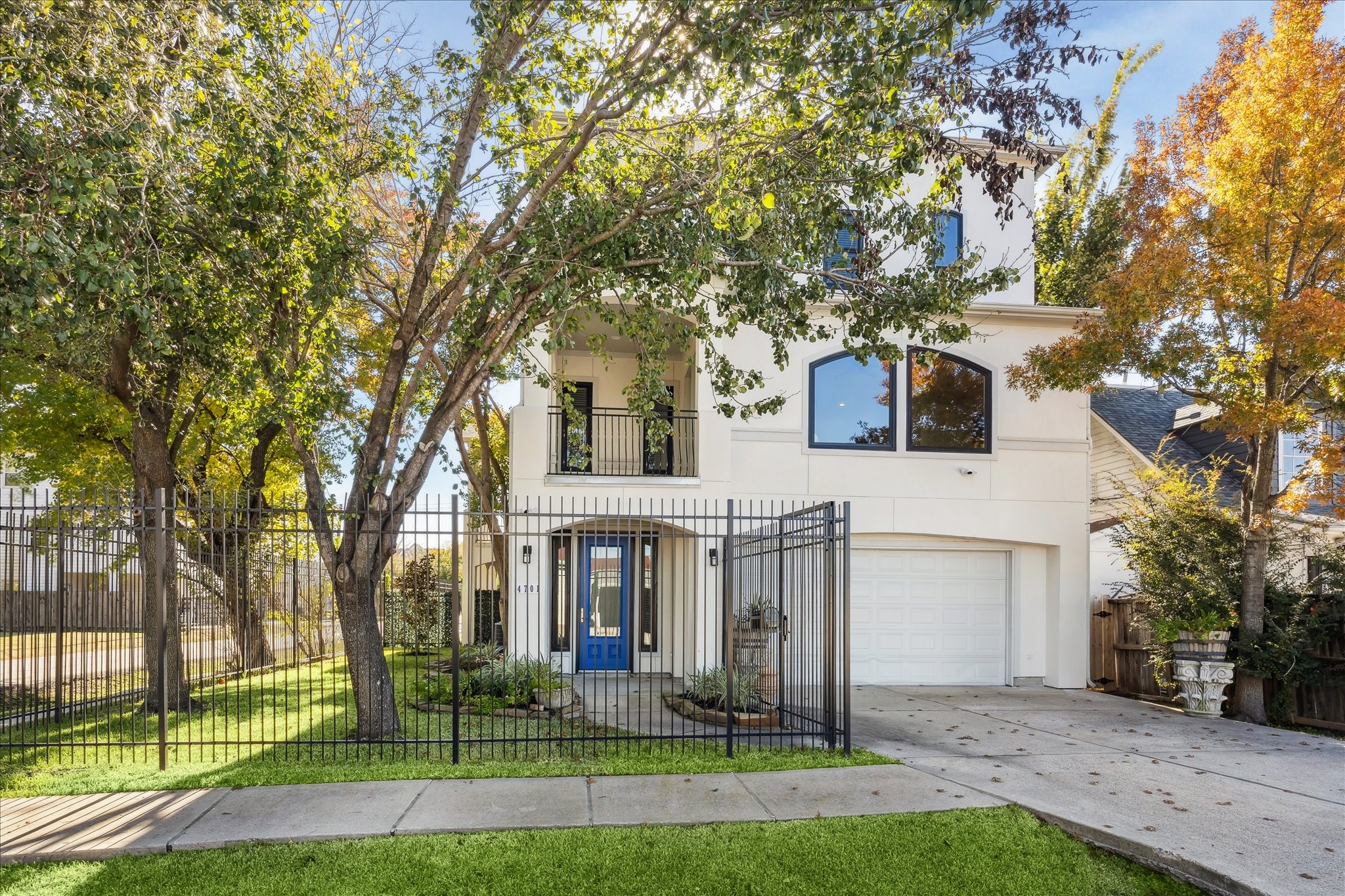 4701 Inker Street Houston, TX 77007 - Photo 2 of 45 a view of a white house with a yard and large trees