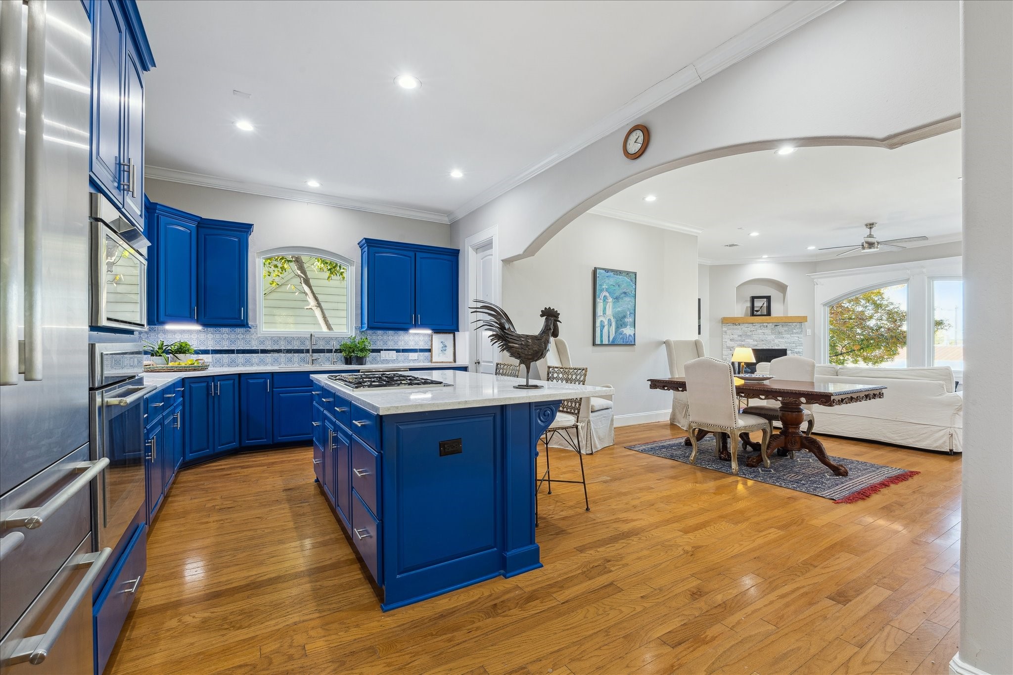 4701 Inker Street Houston, TX 77007 - Photo 22 of 45 a large kitchen with stainless steel appliances granite countertop a stove and a view of living room