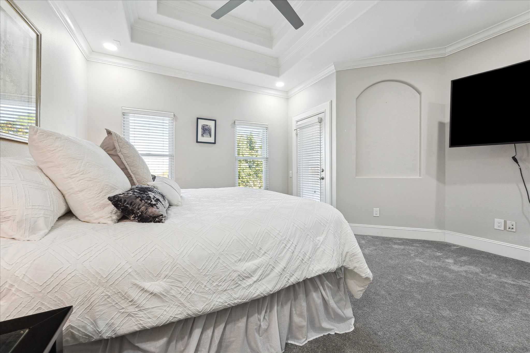 4701 Inker Street Houston, TX 77007 - Photo 27 of 45 a bedroom with a bed and a flat screen tv