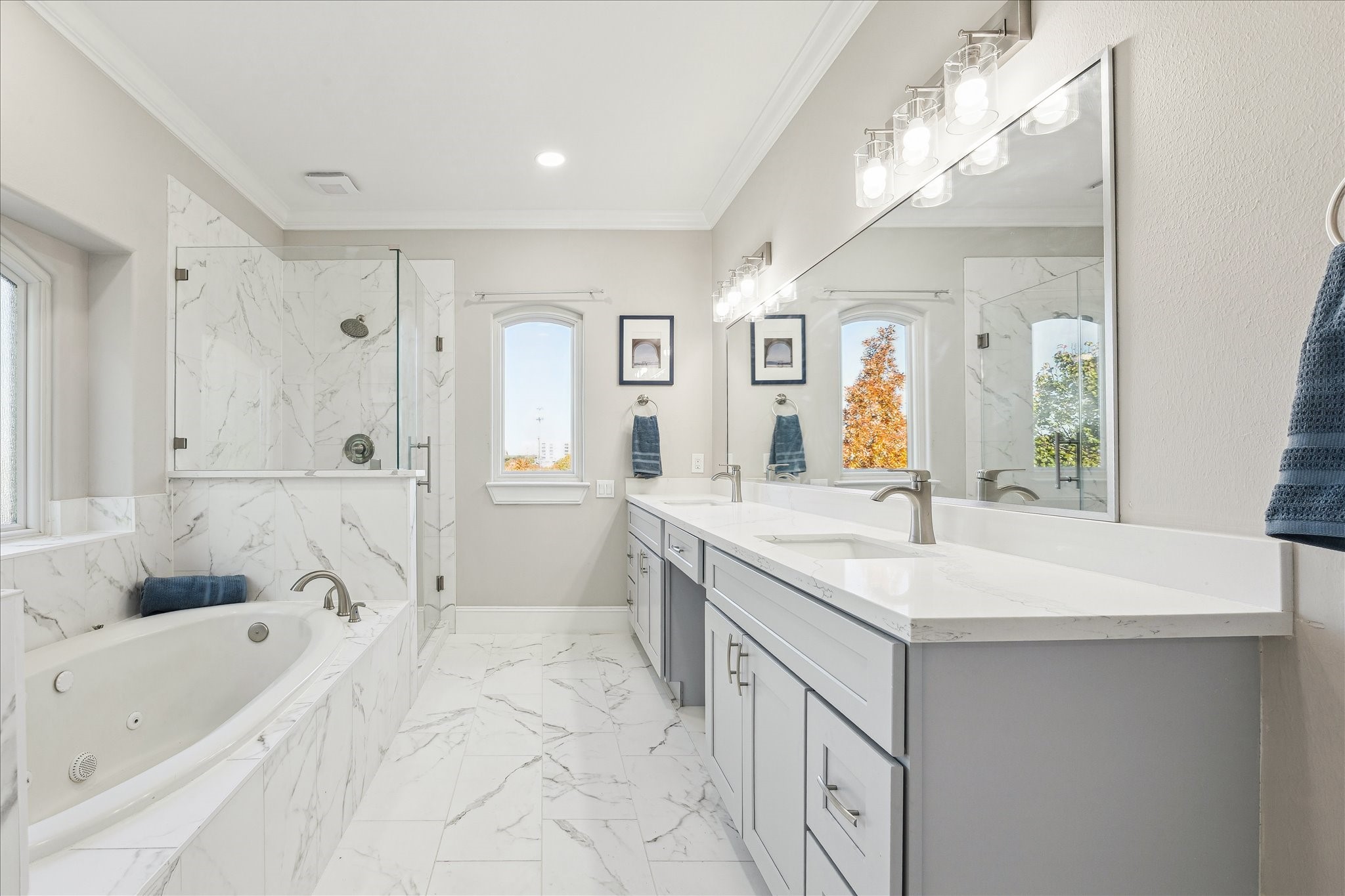 4701 Inker Street Houston, TX 77007 - Photo 29 of 45 a spacious bathroom with a sink a mirror a vanity and shower