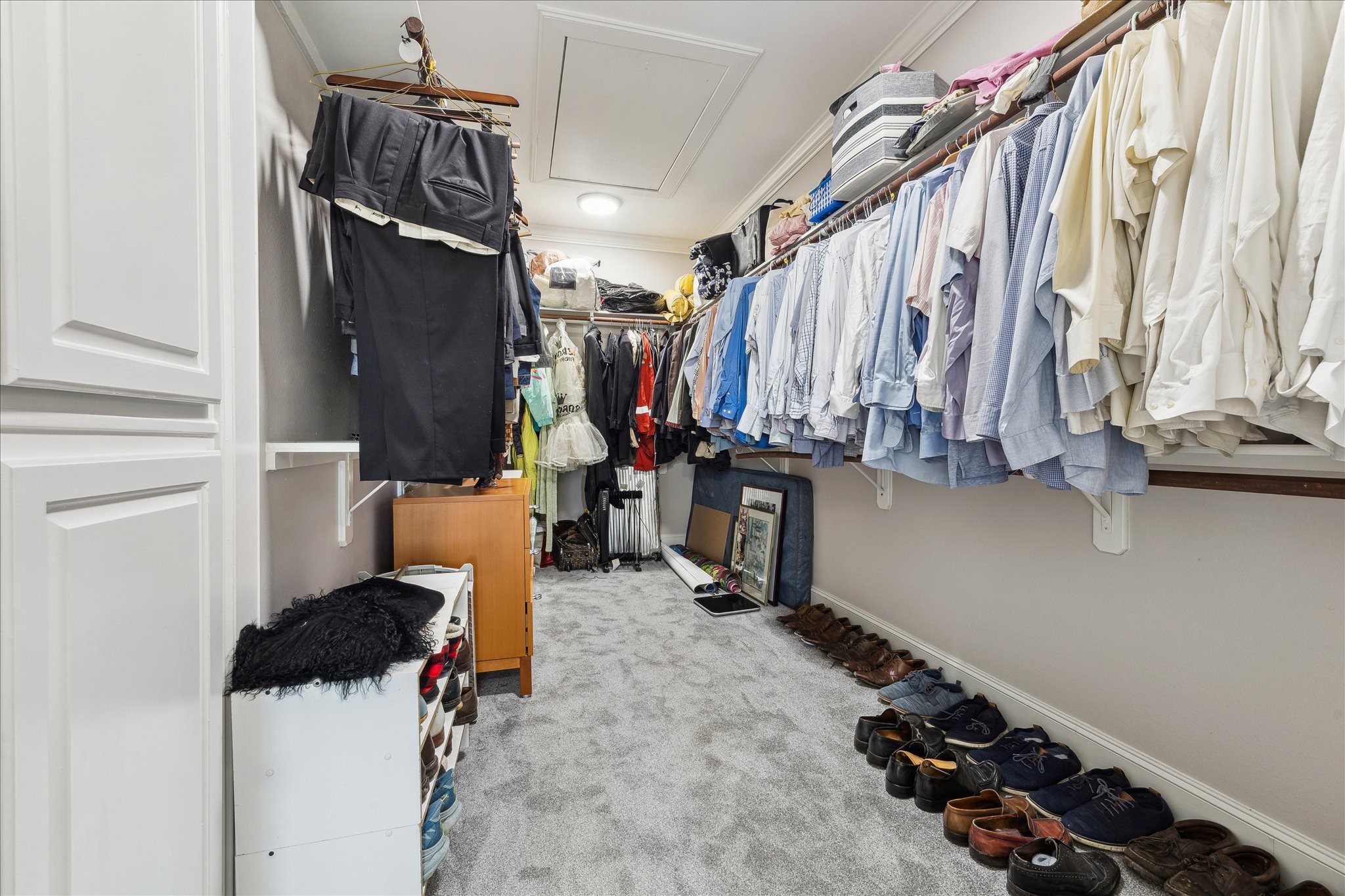 4701 Inker Street Houston, TX 77007 - Photo 33 of 45 a view of walk in closet with clothes and shoes