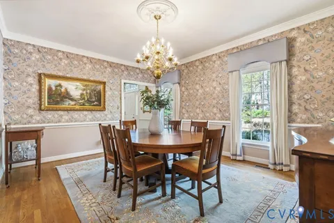 a living room with furniture a fireplace and a table