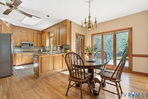 a kitchen with granite countertop a refrigerator and a sink