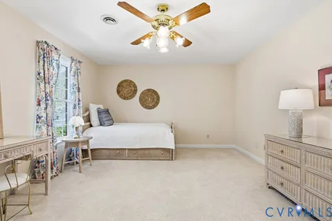 a bedroom with furniture and a chandelier
