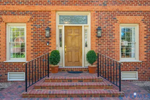 a view of entryway with wooden floor and stairs