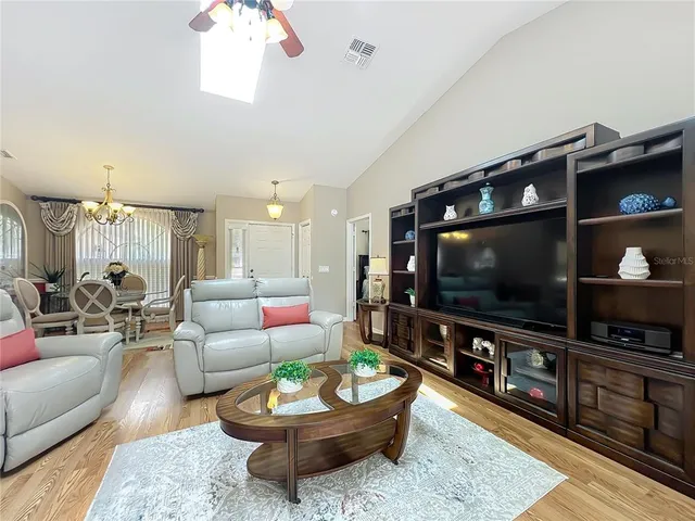 a bedroom with a bed and a tv