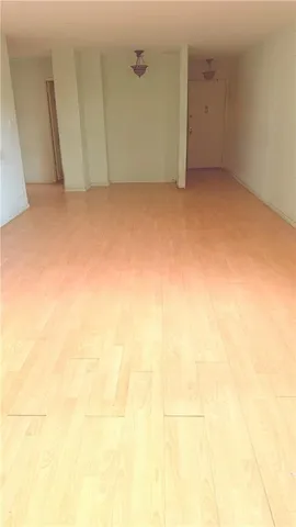 a living room filled with furniture and a large window