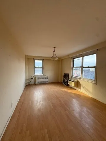 a view of balcony with wooden floor