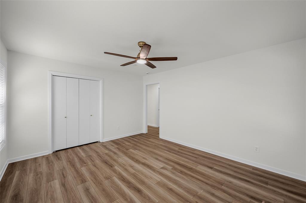 5201 Pine Avenue Waco, TX 76710 - Photo 12 of 33 a view of a room with wooden floor and a ceiling fan