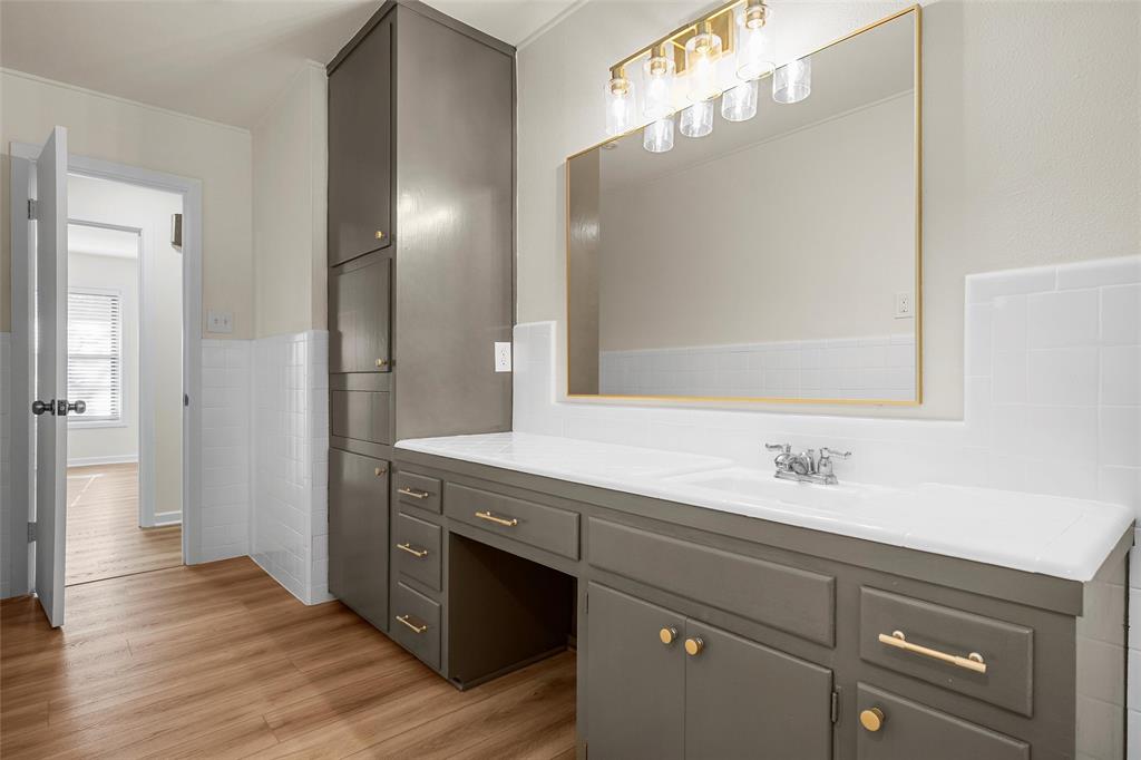 5201 Pine Avenue Waco, TX 76710 - Photo 15 of 33 a bathroom with a sink and a mirror