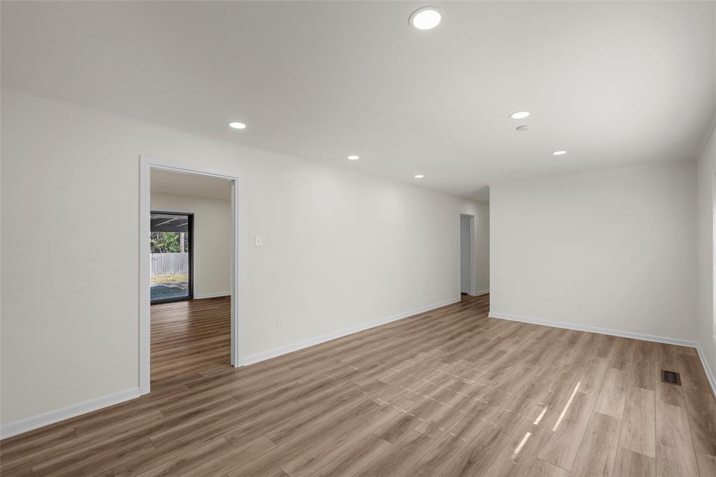 5201 Pine Avenue Waco, TX 76710 - Photo 6 of 33 a view of an empty room with wooden floor and closet