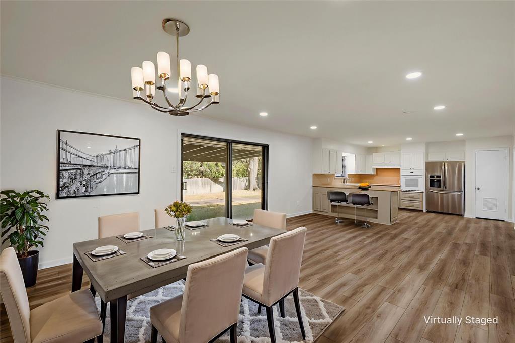 5201 Pine Avenue Waco, TX 76710 - Photo 7 of 33 a view of a dining room with furniture wooden floor and chandelier