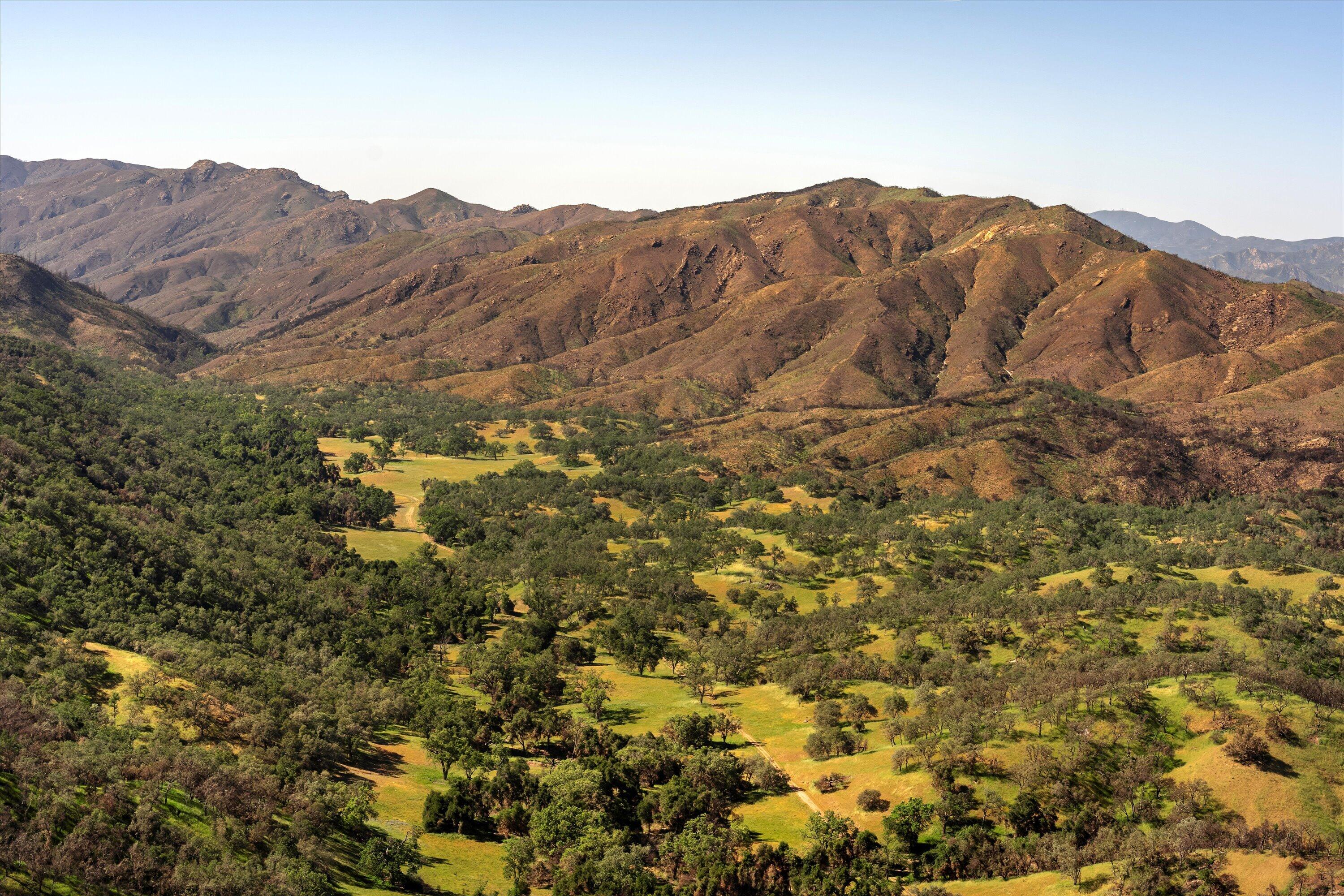 12707 Huasna Road Arroyo Grande, CA 93420 - Photo 57 of 77 a view of a house with a mountain and trees