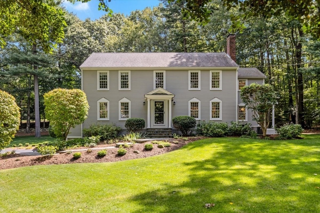 a view of a house with swimming pool and sitting area
