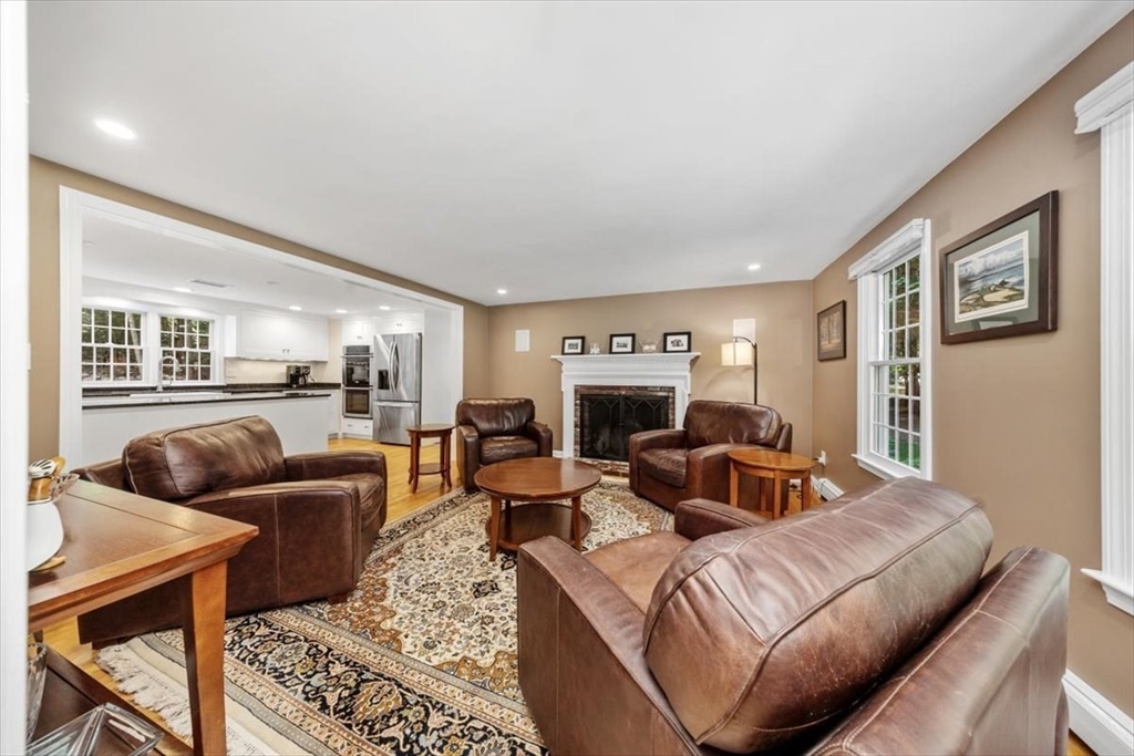 198 Pine Street Norwell, MA 02061 - Photo 11 of 31 a living room with furniture and a fireplace