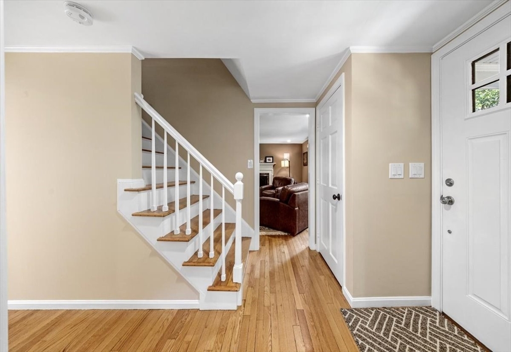 198 Pine Street Norwell, MA 02061 - Photo 14 of 31 a view of a livingroom with wooden floor and stairs
