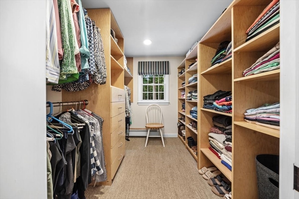 198 Pine Street Norwell, MA 02061 - Photo 18 of 31 a view of walk in closet with clothes and shoes