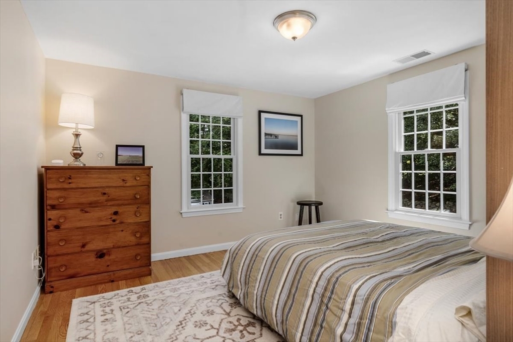 198 Pine Street Norwell, MA 02061 - Photo 19 of 31 a bedroom with a bed and a dresser