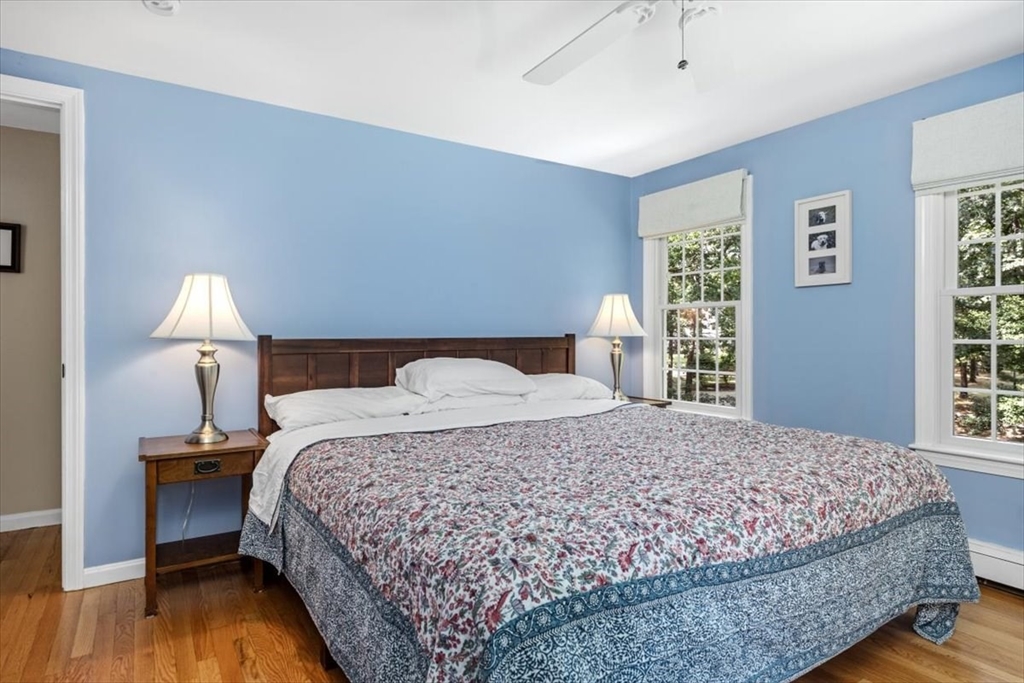 198 Pine Street Norwell, MA 02061 - Photo 20 of 31 a bedroom with a bed and wooden floor