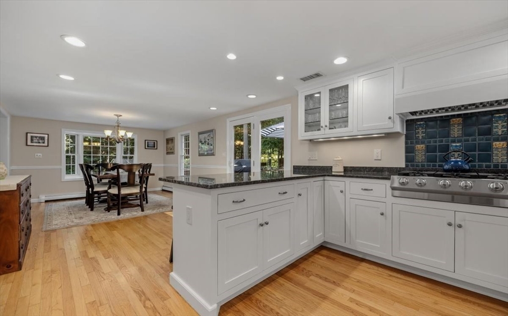 198 Pine Street Norwell, MA 02061 - Photo 4 of 31 a kitchen with stainless steel appliances granite countertop a stove a sink and a microwave