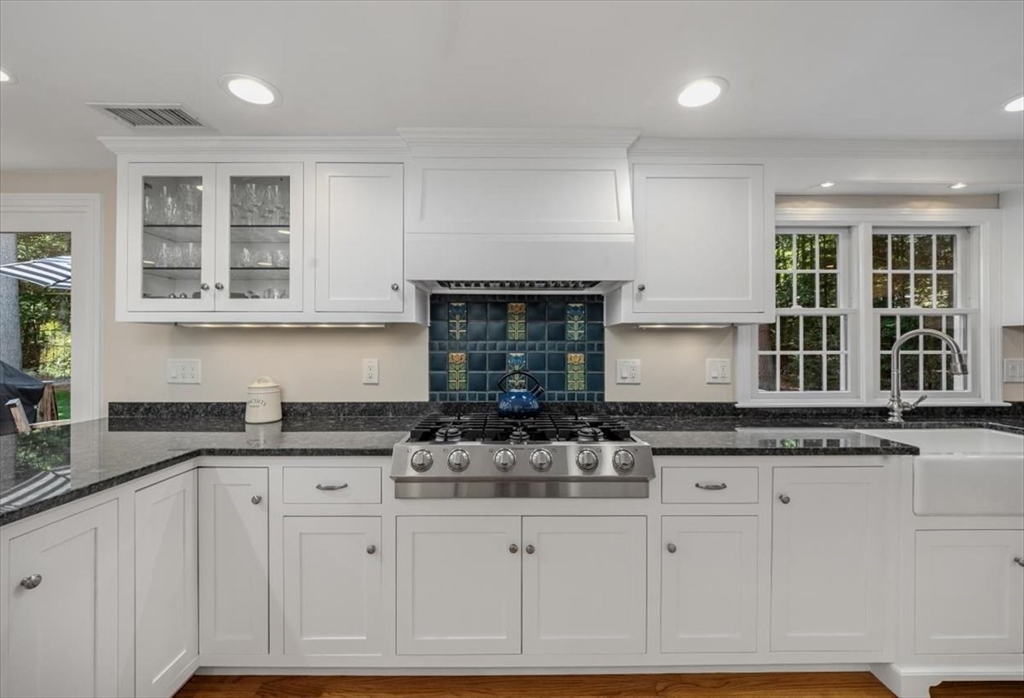 198 Pine Street Norwell, MA 02061 - Photo 5 of 31 a kitchen with granite countertop a sink and cabinets