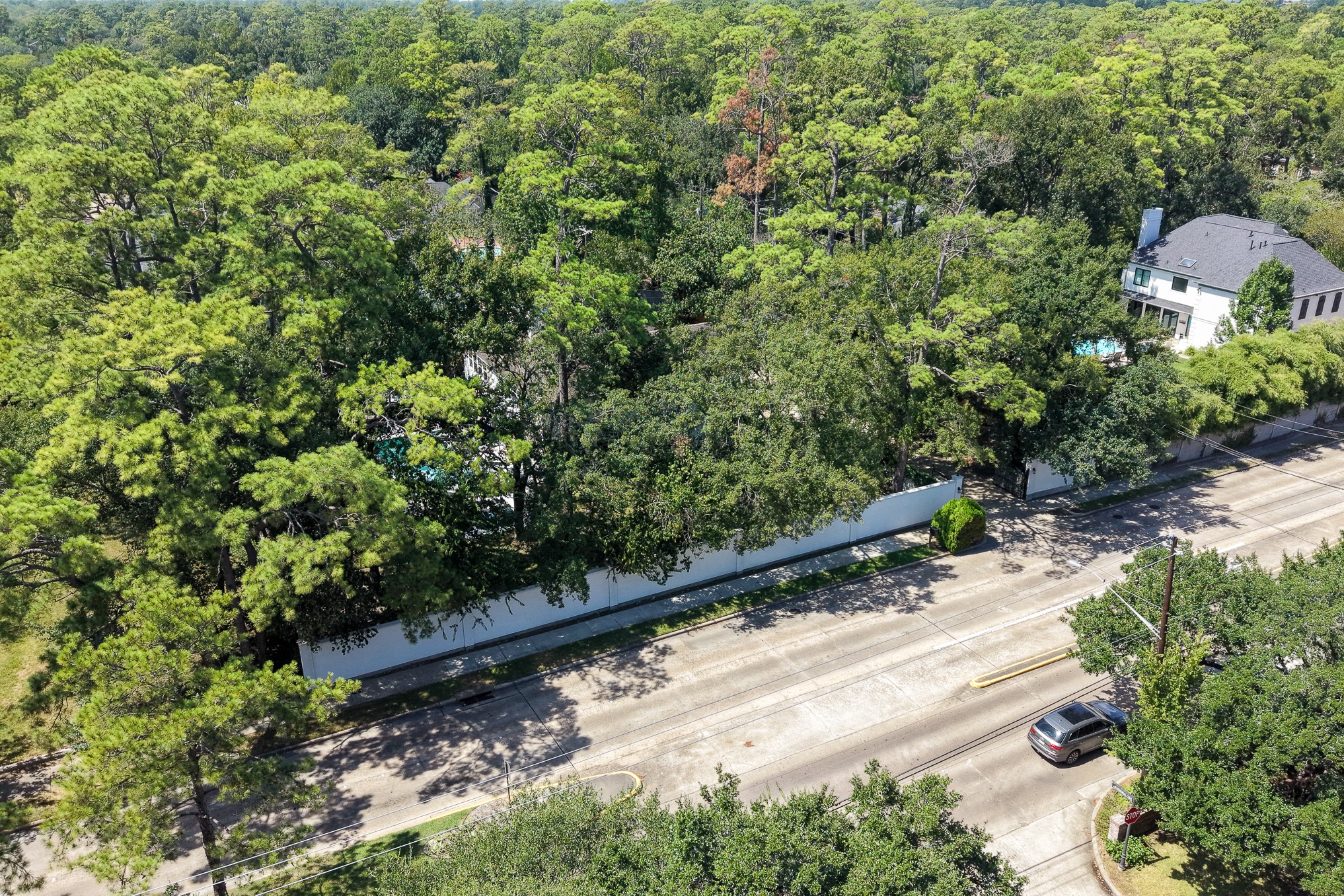 335 Voss Road Houston, TX 77024 - Photo 44 of 50 Aerial view highlighting the estate's serene, wooded setting.