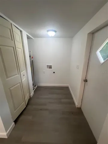 a view of a hallway with staircase