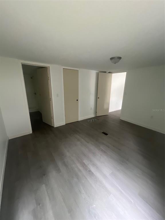 1001 Northeast 77th Street, Unit 3 Ocala, FL 34479 - Photo 9 of 20 an empty room with windows