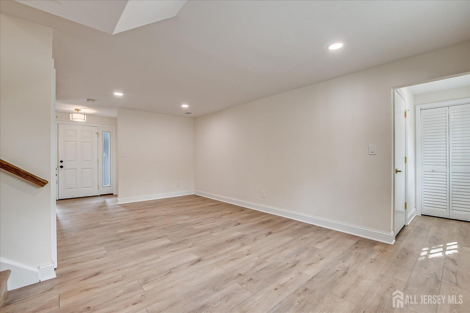 21 Lydia Lane Edison, NJ 08817 - Photo 15 of 49 a view of an empty room with wooden floor
