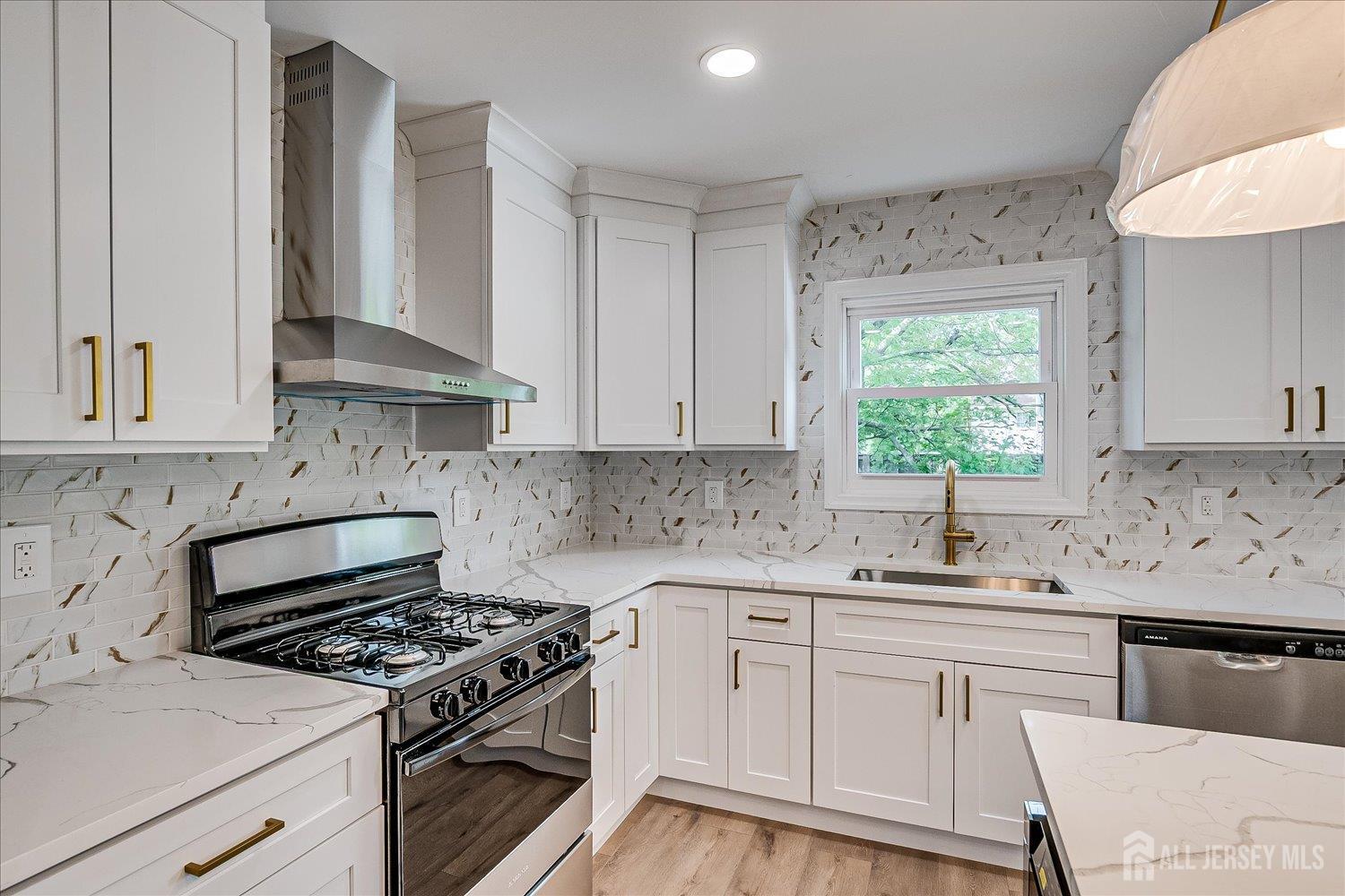 21 Lydia Lane Edison, NJ 08817 - Photo 25 of 49 a kitchen with granite countertop a sink stove and cabinets