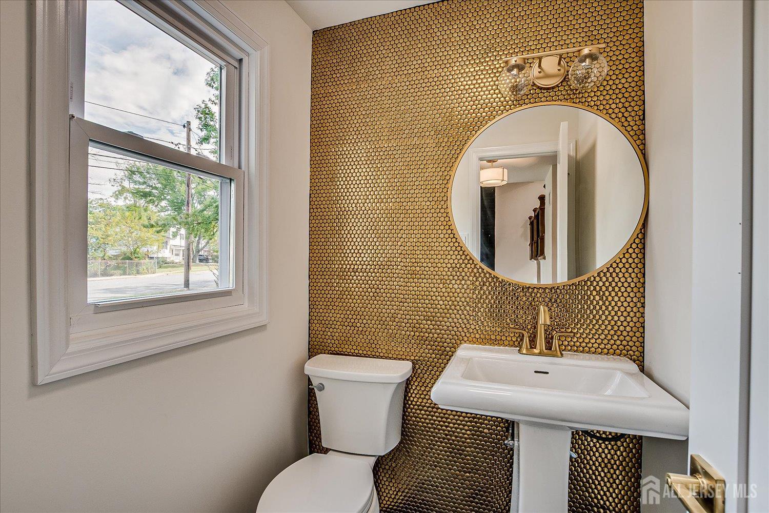 21 Lydia Lane Edison, NJ 08817 - Photo 29 of 49 a bathroom with a toilet sink and mirror