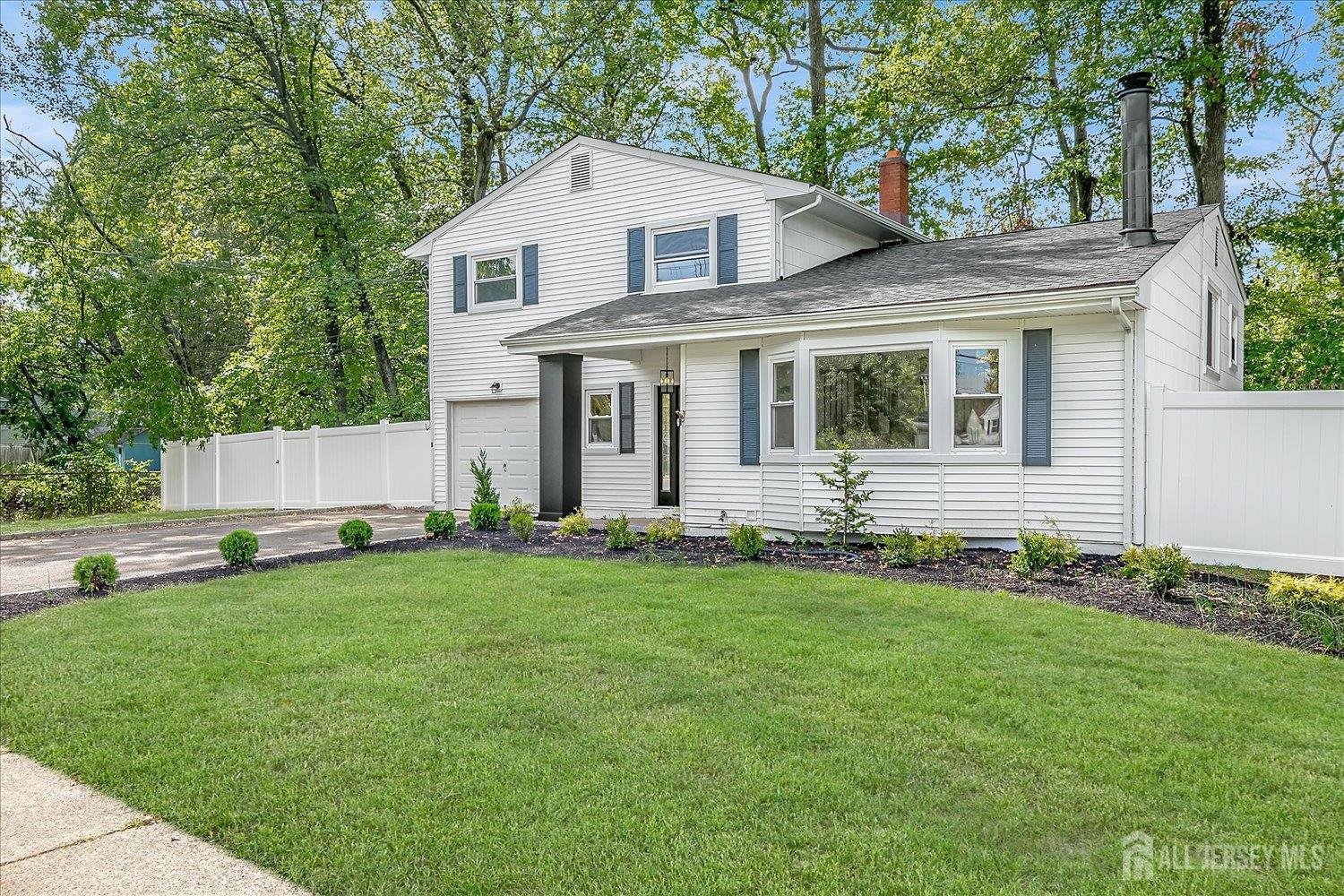21 Lydia Lane Edison, NJ 08817 - Photo 3 of 49 front view of a house with a yard