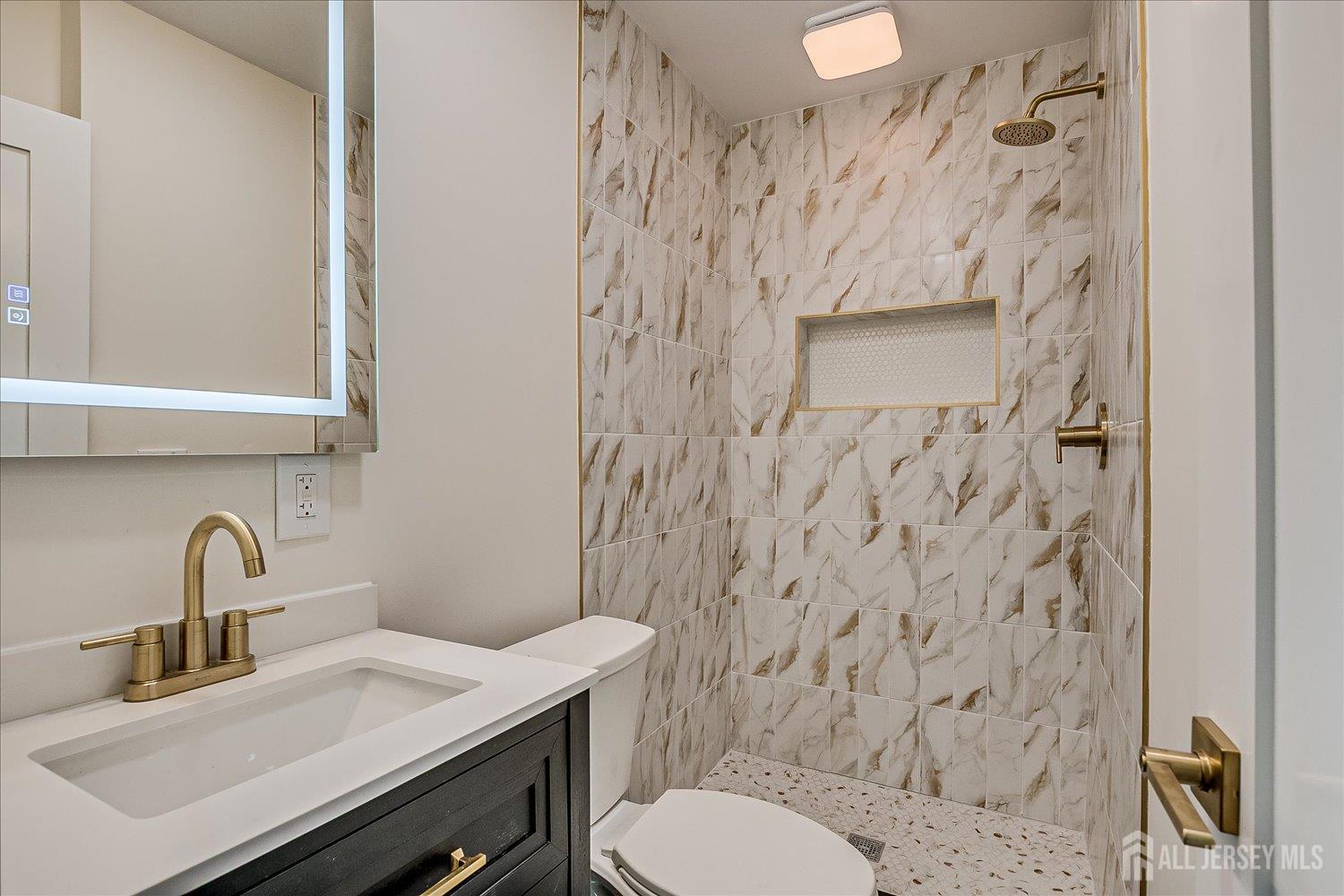 21 Lydia Lane Edison, NJ 08817 - Photo 33 of 49 a bathroom with a sink and a toilet