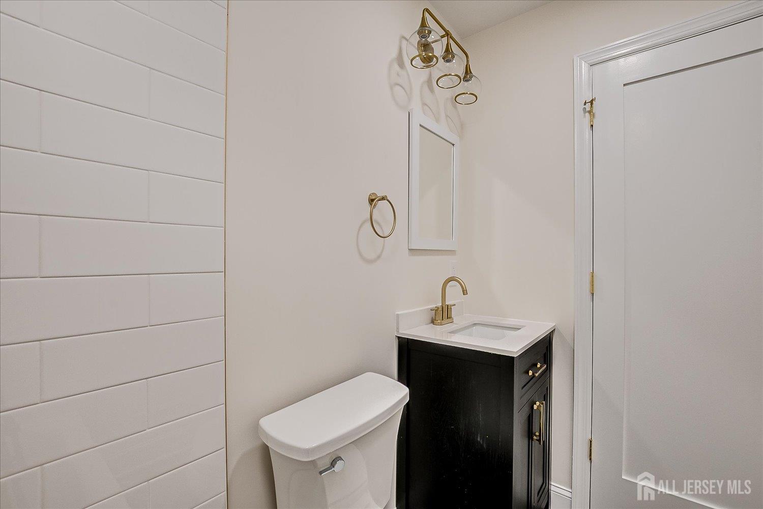 21 Lydia Lane Edison, NJ 08817 - Photo 39 of 49 a bathroom with a sink toilet and mirror