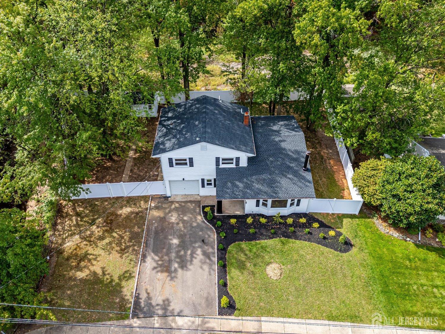 21 Lydia Lane Edison, NJ 08817 - Photo 4 of 49 an aerial view of a house with a yard