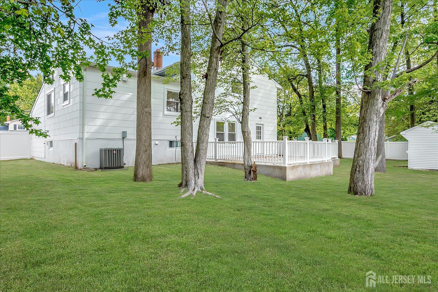 21 Lydia Lane Edison, NJ 08817 - Photo 44 of 49 a view of a garden with a tree