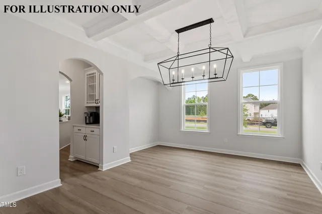 a kitchen with stainless steel appliances a sink a microwave a refrigerator and white cabinets