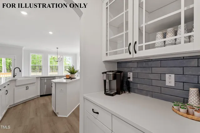 a view of an empty room with wooden floor chandeliers
