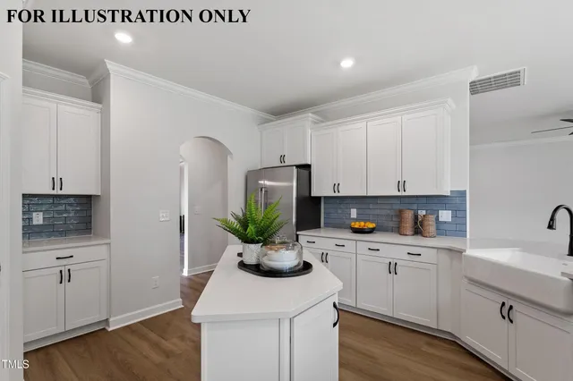 a view of an empty room with wooden floor fireplace and a window