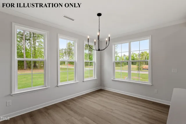 an empty room with windows and ceiling fan