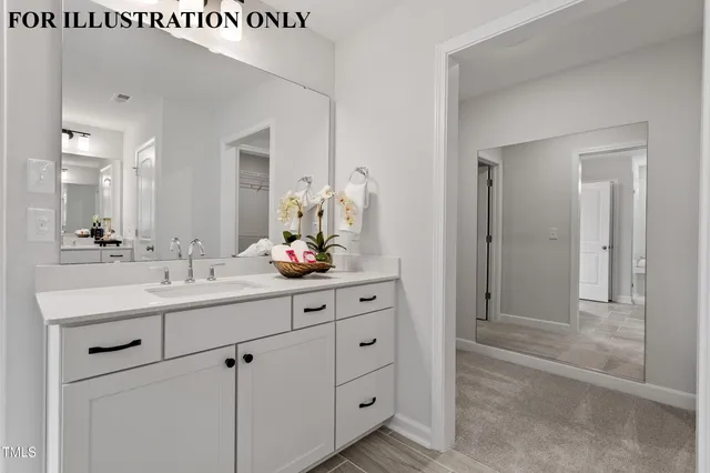 a view of a workspace with furniture and wooden floor