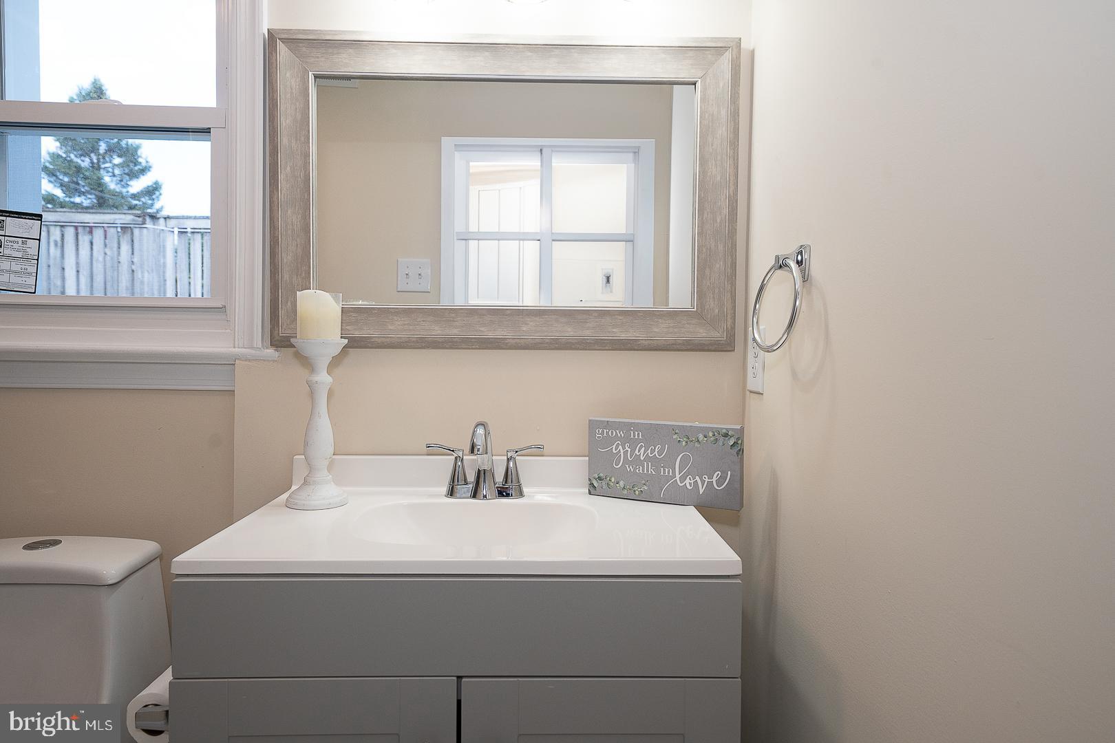 632 Merion Avenue Upper Darby, PA 19082 - Photo 17 of 84 a bathroom with a sink a toilet and a window