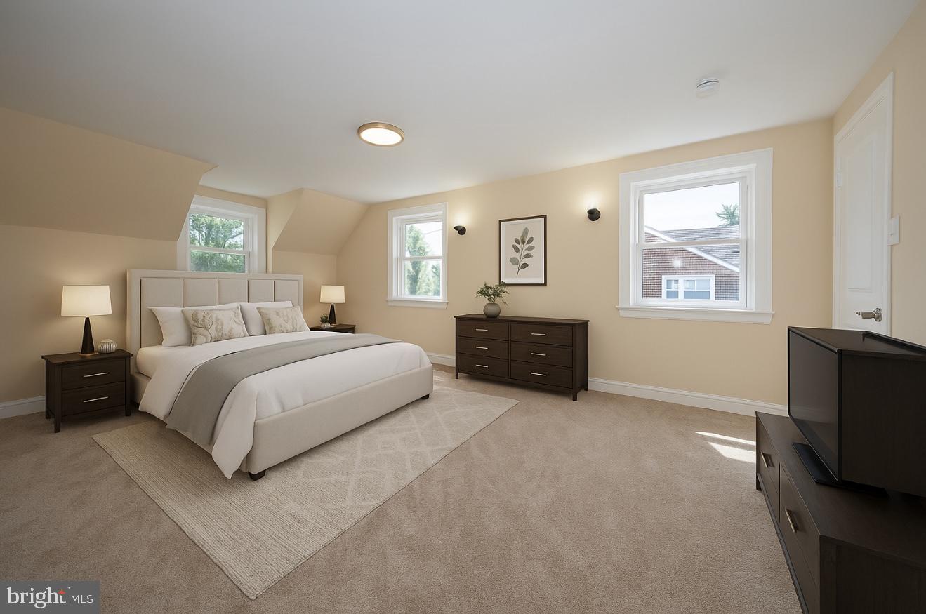 632 Merion Avenue Upper Darby, PA 19082 - Photo 2 of 84 a spacious bedroom with a bed and a couch
