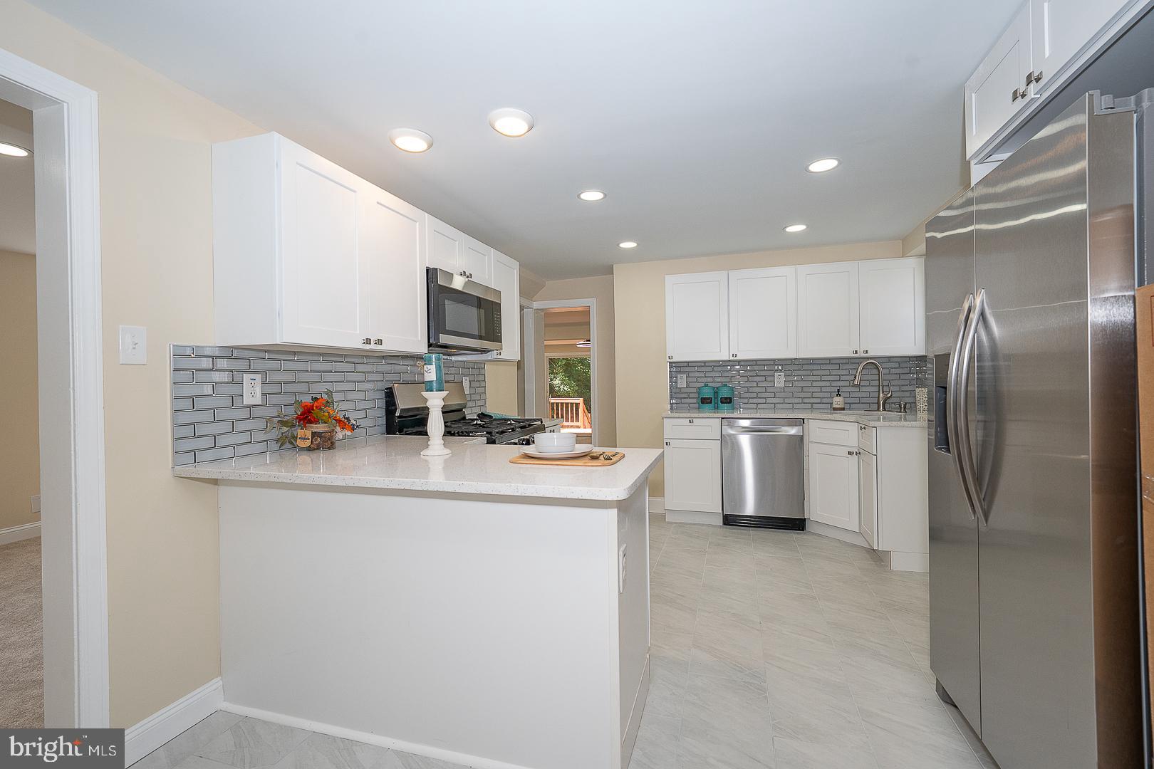 632 Merion Avenue Upper Darby, PA 19082 - Photo 28 of 84 a kitchen with stainless steel appliances a refrigerator and a stove top oven