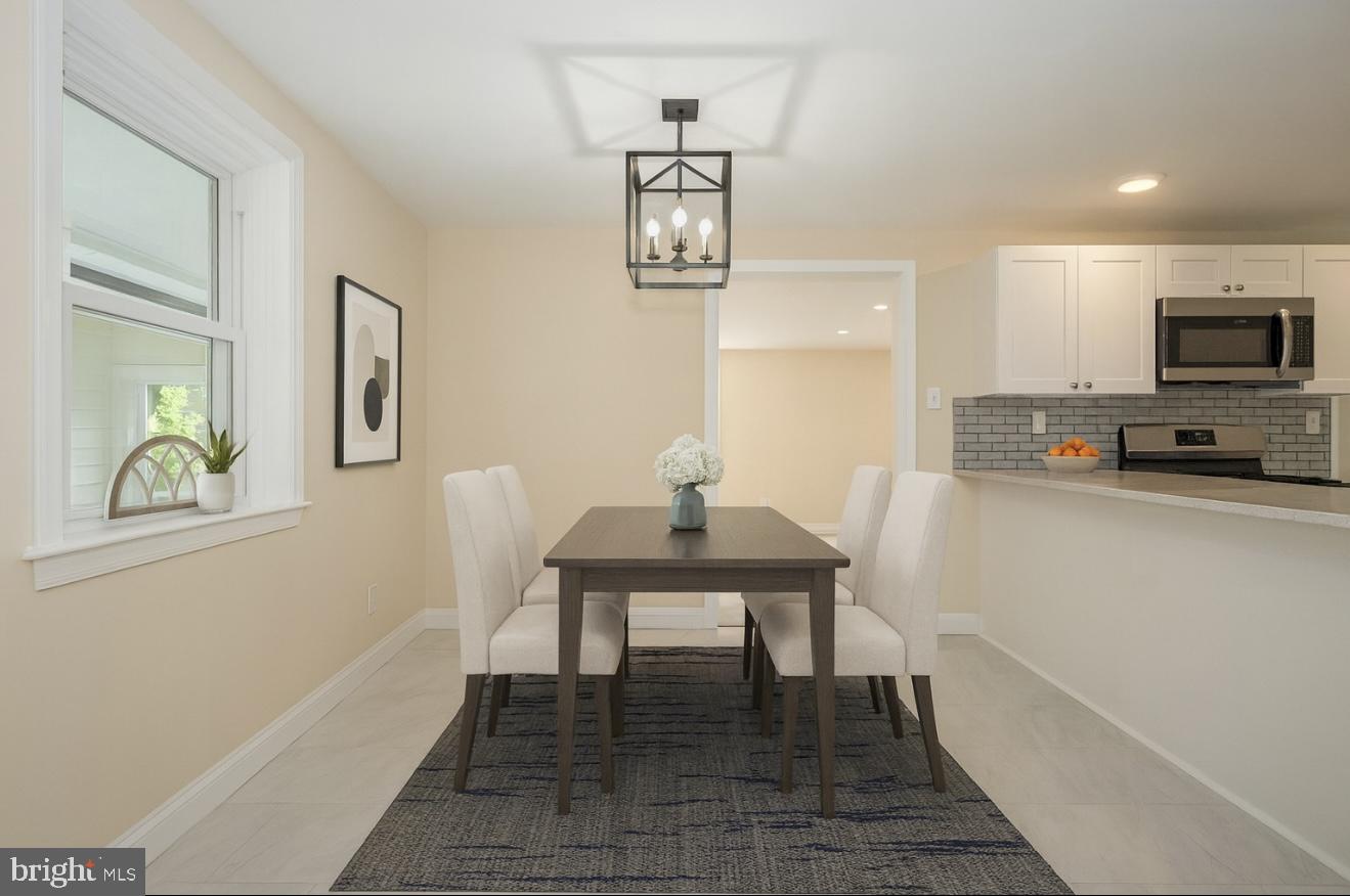 632 Merion Avenue Upper Darby, PA 19082 - Photo 3 of 84 a view of a workspace with furniture wooden floor and a window