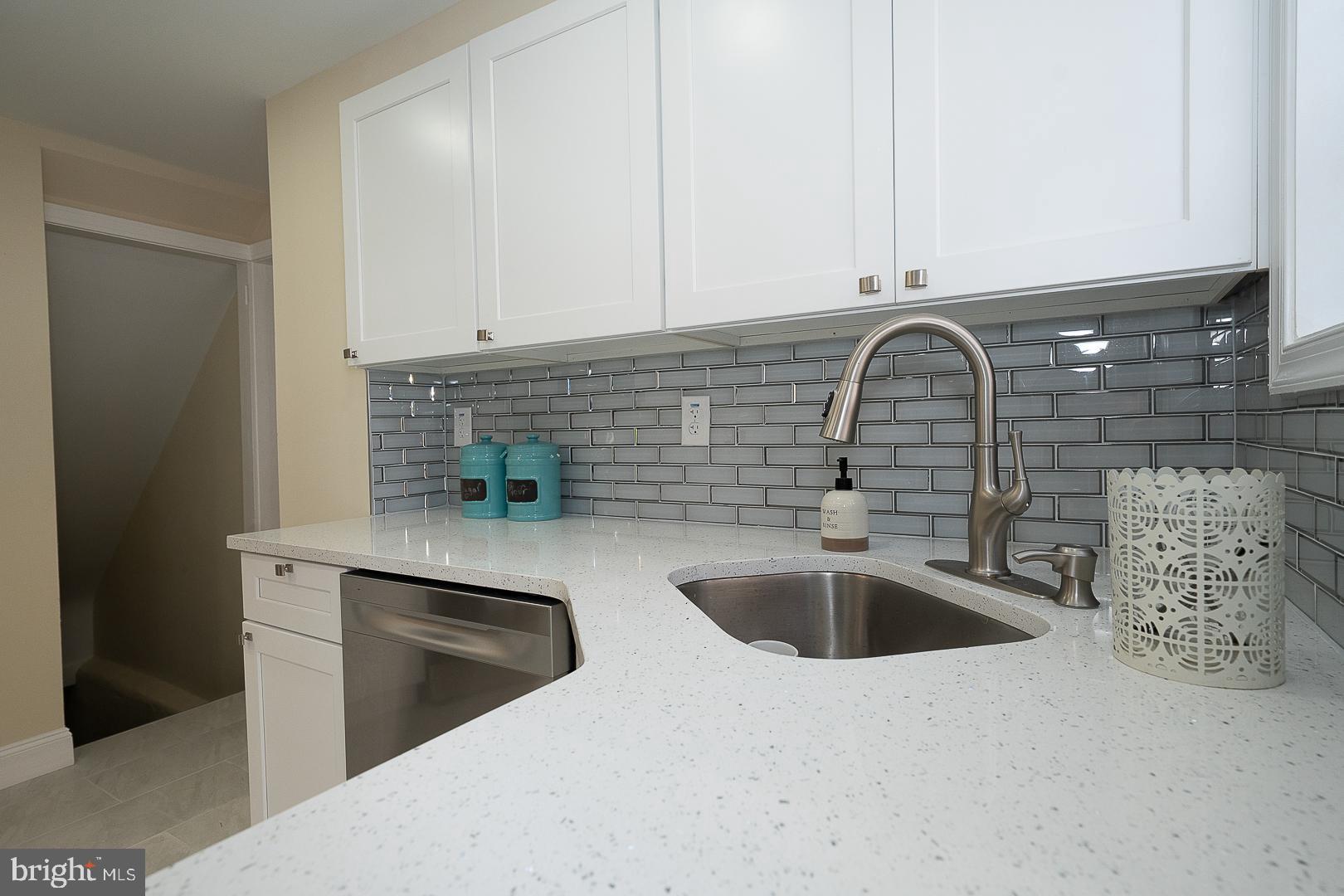 632 Merion Avenue Upper Darby, PA 19082 - Photo 37 of 84 a kitchen with stainless steel appliances granite countertop a sink and cabinets