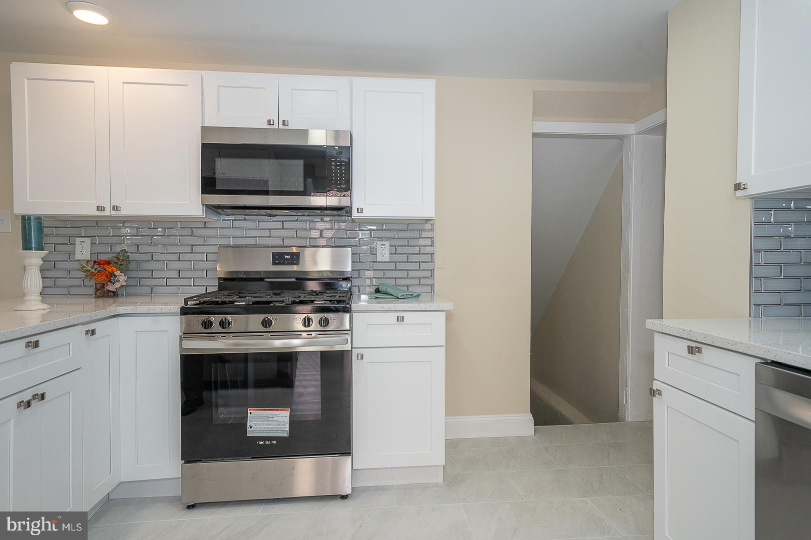 632 Merion Avenue Upper Darby, PA 19082 - Photo 38 of 84 a kitchen with a stove and a microwave